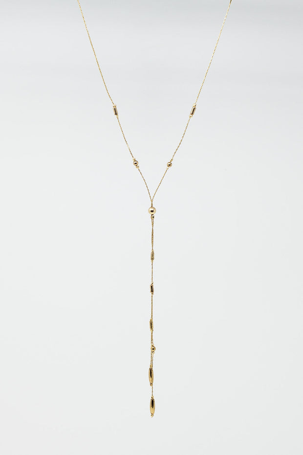 Long Gold Necklance With Golden Beads Throughout and Long Golden Tassle