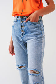 Sraight-Leg Jeans With Exposed Buttons and Ripped Knees in Light Wash