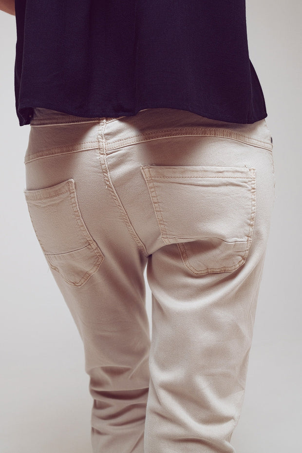 Exposed Buttons Skinny Jeans in Beige