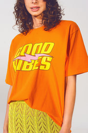 T-Shirt With Good Vibes Text in Orange