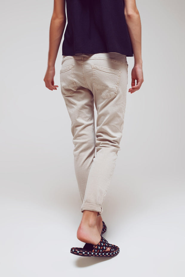 Exposed Buttons Skinny Jeans in Beige