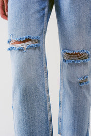 Sraight-Leg Jeans With Exposed Buttons and Ripped Knees in Light Wash